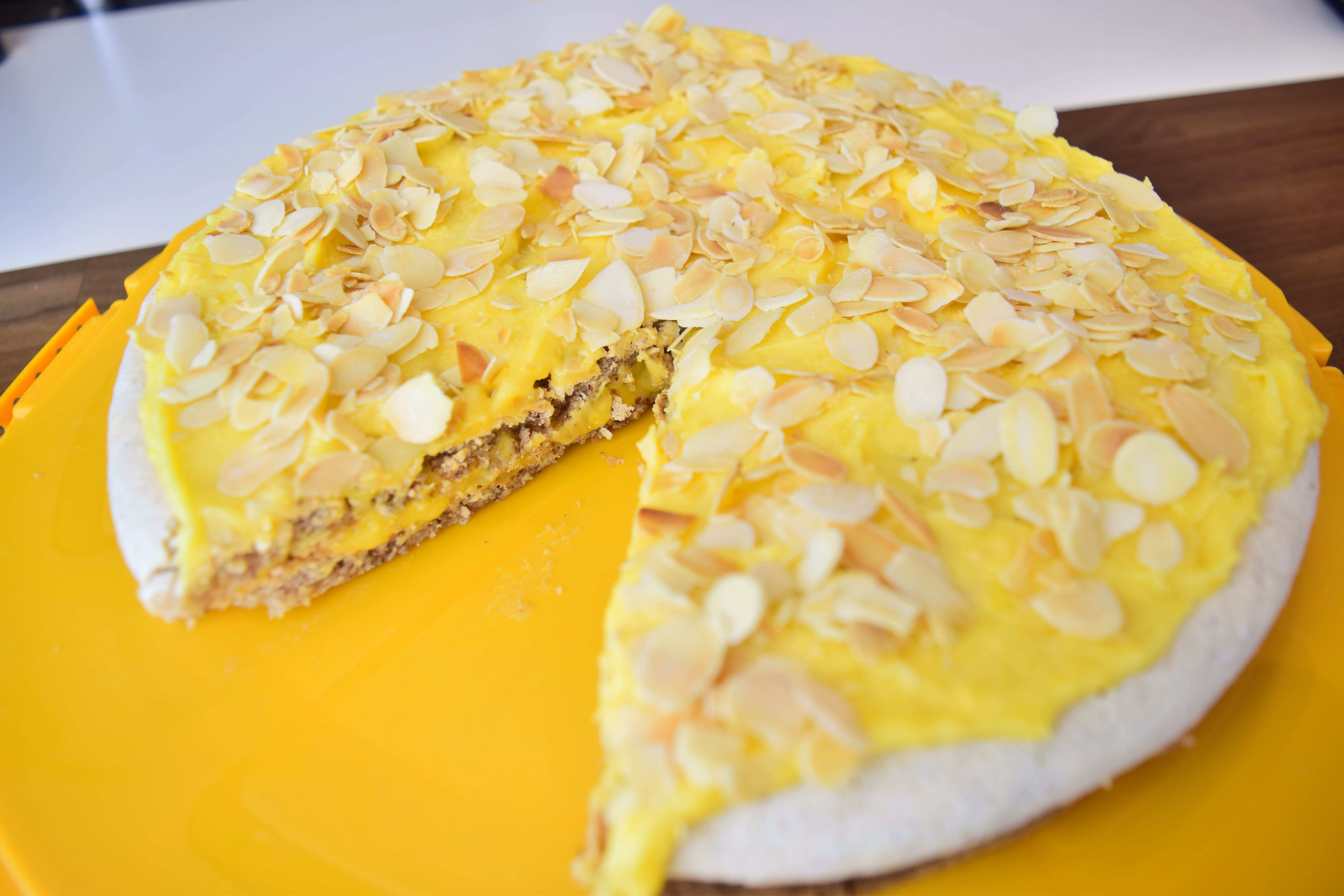 Swedish almond cake (Mandeltårta) is a cake that is made with two layers of  almond meringue cake, in between there is a rich cream and all the cake is  covered with toasted